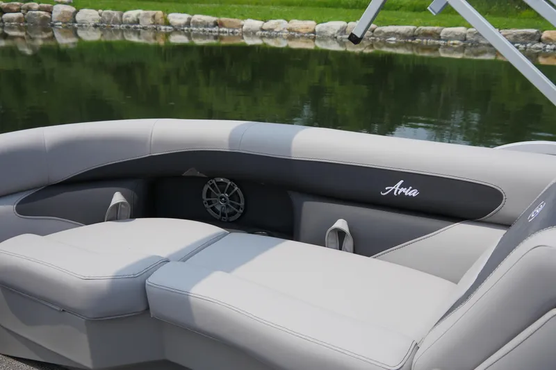 Slide: The Image of 2025 Barletta ARIA 22QC boat interior with gray seating and speaker detail. - 8