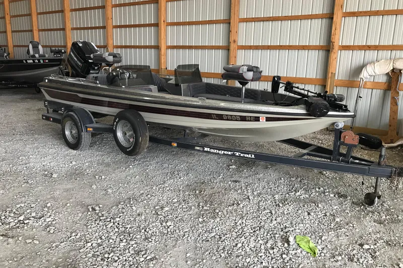 The Image of 1990 Ranger 375V boat on trailer in storage facility. - 1
