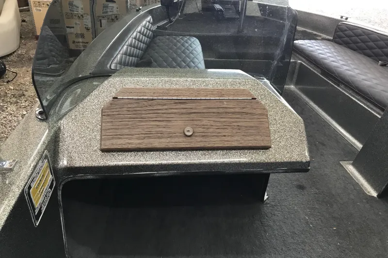 Slide: The Image of 1990 Ranger 375V boat interior with quilted seats and wooden dashboard. - 11