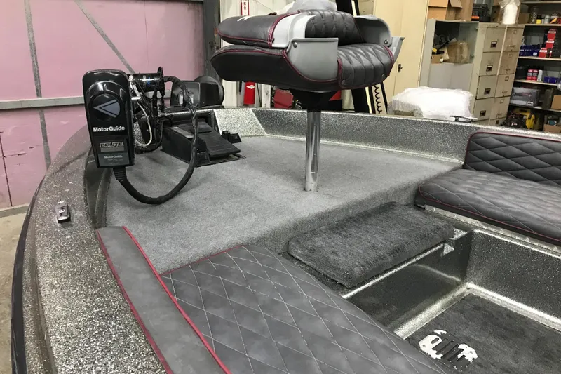 Slide: The Image of 1990 Ranger 375V boat interior with MotorGuide trolling motor and cushioned seating. - 17