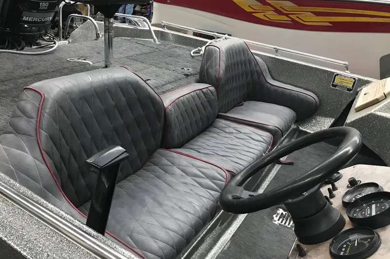Slide: The Image of 1990 Ranger 375V boat interior with quilted seats and steering wheel. - 23