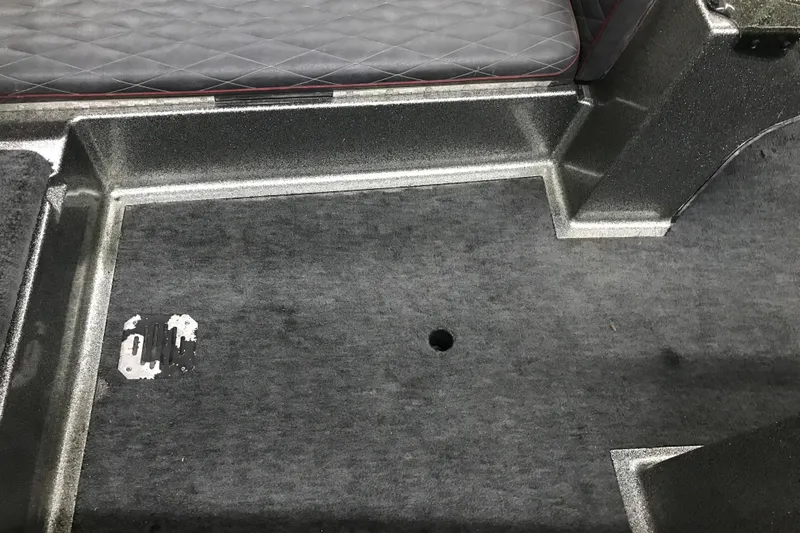 Slide: The Image of Interior of a 1990 Ranger 375V boat showing carpeted floor and seating area. - 24