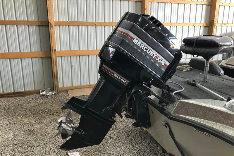 Slide: The Image of 1990 Ranger 375V boat with Mercury XR4 outboard motor in storage. - 4