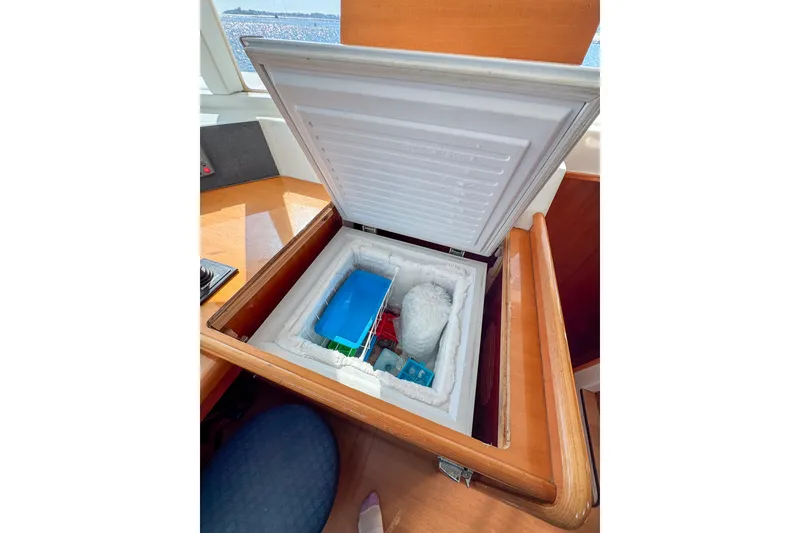 Slide: The Image of Built-in freezer on 2005 Lagoon 440 yacht, open with contents visible. - 29