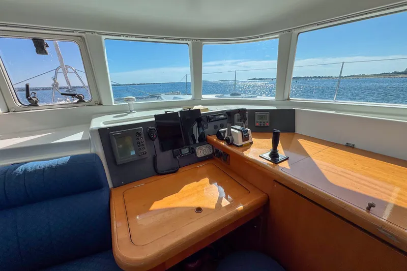Slide: The Image of Interior view of 2005 Lagoon 440 catamaran cockpit with navigation equipment and ocean view. - 31