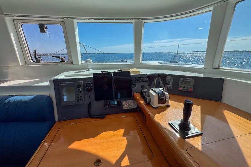 Slide: The Image of Interior view of 2005 Lagoon 440 catamaran cockpit with ocean view. - 32