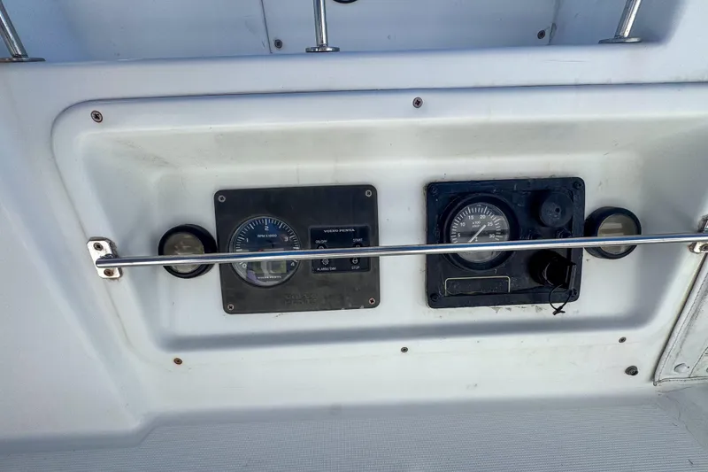 Slide: The Image of Control panel of a 2005 Lagoon 440 catamaran with gauges and switches. - 5