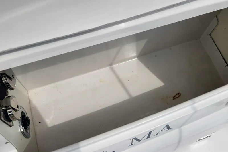 Slide: The Image of Empty storage compartment on a 2006 Larson 3700 Cabrio boat. - 20