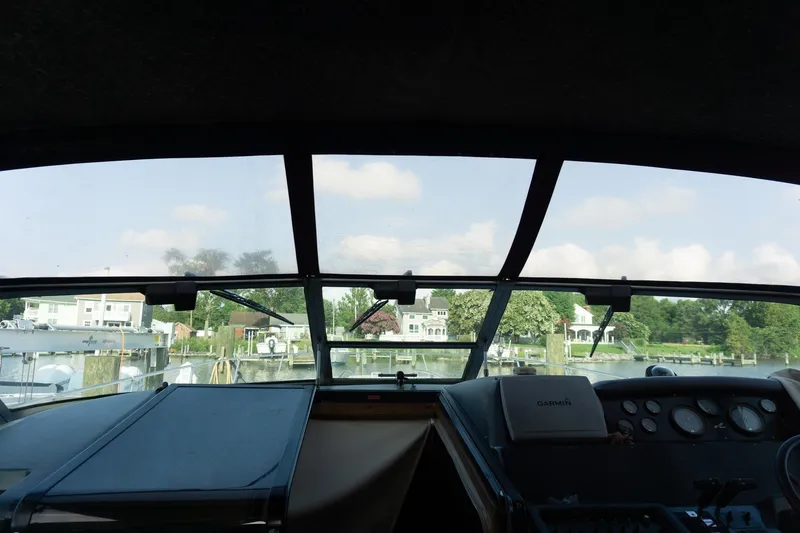 Slide: The Image of Interior view from 1993 Sea Ray 400 Express Cruiser, overlooking a serene waterfront neighborhood. - 14