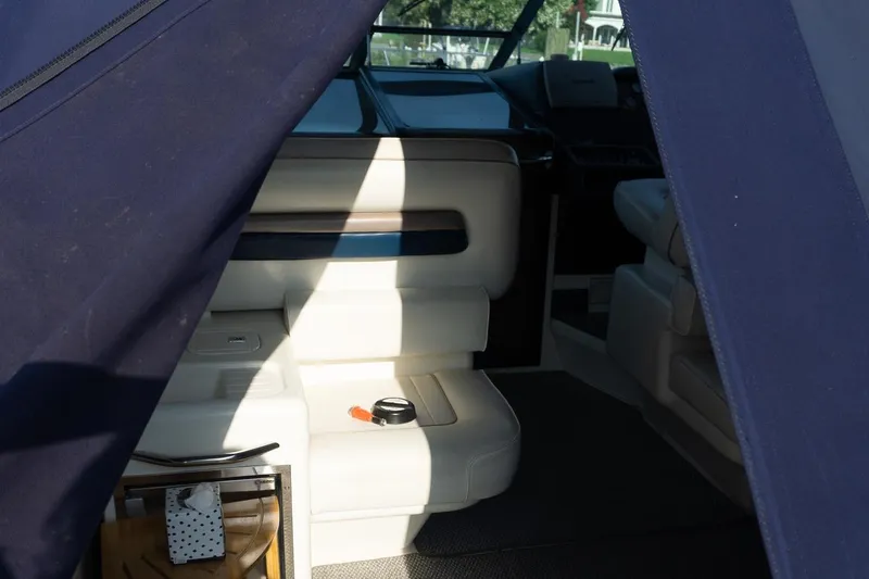 Slide: The Image of Interior view of 1993 Sea Ray 400 Express Cruiser with seating and dashboard. - 16