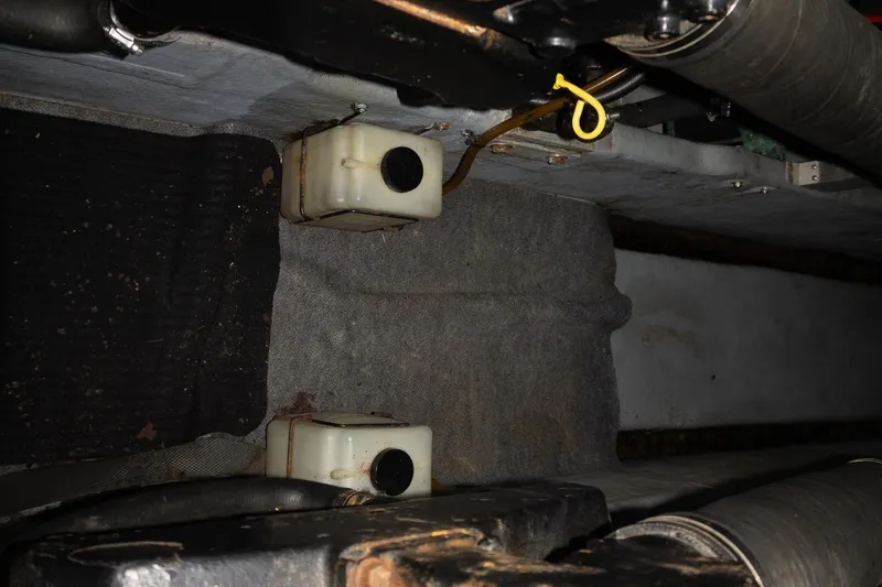 Slide: The Image of Engine compartment of a 1993 Sea Ray 400 Express Cruiser with visible components. - 30
