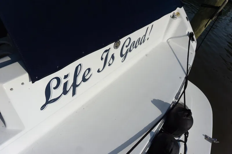 Slide: The Image of 1993 Sea Ray 400 Express Cruiser with "Life Is Good!" text on the stern. - 7