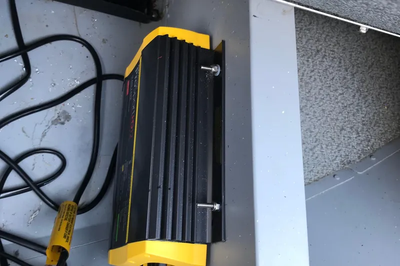 Slide: The Image of Battery charger installed in a 2013 Lund 1600 Fury Tiller boat. - 17