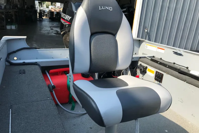 Slide: The Image of 2013 Lund 1600 Fury Tiller boat interior with a comfortable seat and Mercury engine. - 20