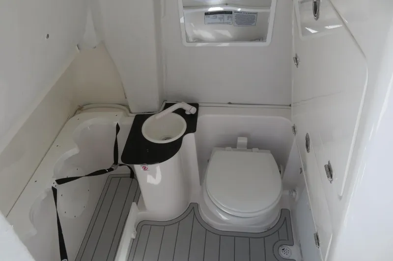 Slide: The Image of Interior of 2025 Sea Fox 268 Commander boat bathroom with toilet and sink. - 25