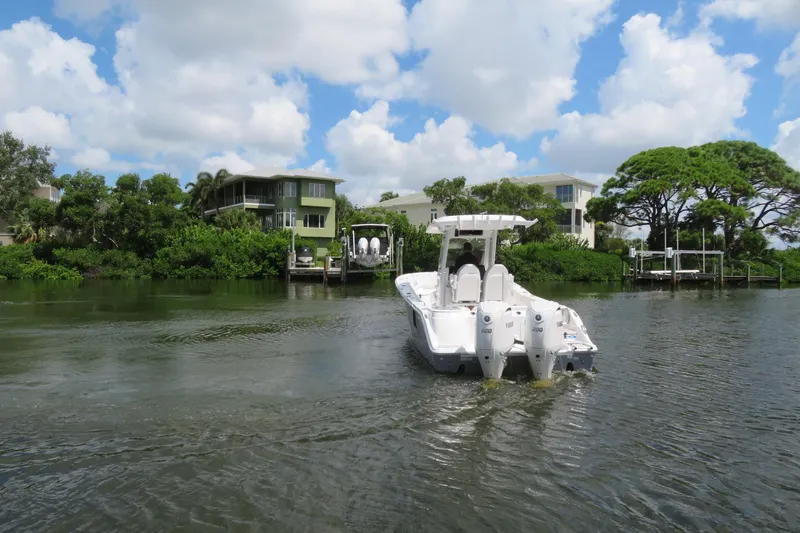 Slide: The Image of Sea Fox 268 Commander boat with twin Yamaha F200 engines on a serene waterway in Sarasota, FL. - 47