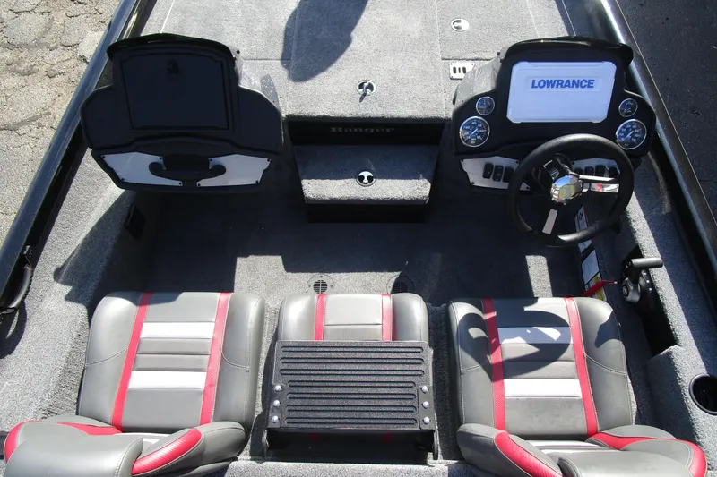 Slide: The Image of 2025 Ranger RT 198 P boat interior with dual seats, steering wheel, and Lowrance display. - 10