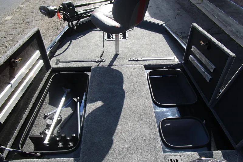 Slide: The Image of 2025 Ranger RT 198 P boat interior with storage compartments and seating. - 13