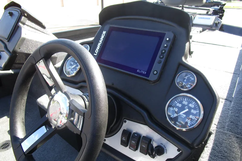 Slide: The Image of 2025 Ranger RT 198 P boat dashboard with steering wheel, gauges, and Lowrance Elite display. - 7