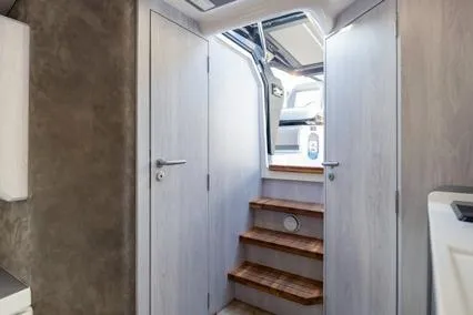 Slide: The Image of Interior of 2025 Hanover 387 Classic Luxury Edition with wooden steps and modern design. - 10