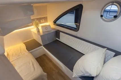 Slide: The Image of Luxurious interior of 2025 Hanover 387 Classic Luxury Edition yacht cabin with modern furnishings. - 11