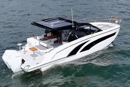 Slide: The Image of 2025 Hanover 387 Classic Luxury Edition boat cruising on open water. - 5