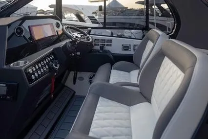 Slide: The Image of Interior of 2025 Hanover 387 Classic Luxury Edition boat with modern dashboard and plush seating. - 6