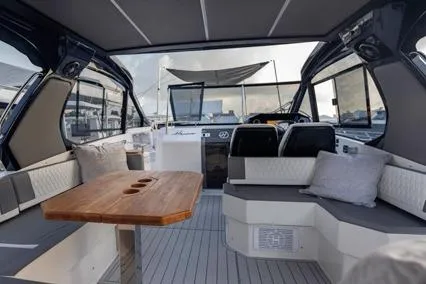 Slide: The Image of 2025 Hanover 387 Classic Luxury Edition yacht interior with elegant seating and wooden table. - 7