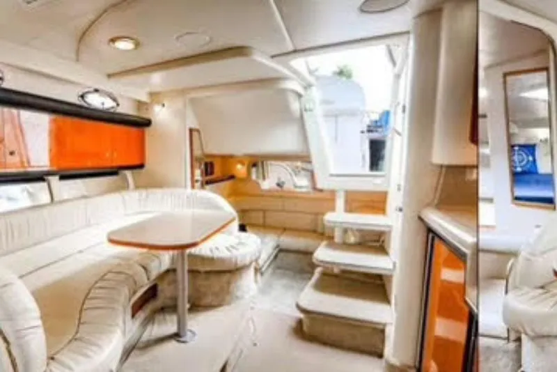 Slide: The Image of Luxurious interior of a 2000 Sea Ray 340 Sundancer yacht with plush seating and modern design. - 8