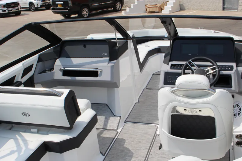 Slide: The Image of 2025 Cobalt R4 Surf boat interior with modern dashboard and luxurious seating. - 11