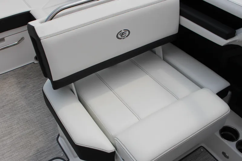 Slide: The Image of 2025 Cobalt R4 Surf boat interior with white and black seating, featuring sleek design. - 19