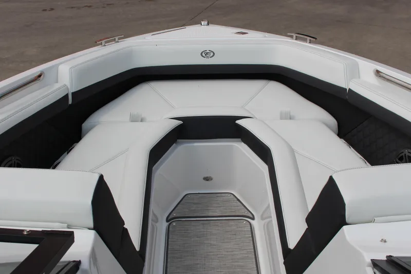 Slide: The Image of 2025 Cobalt R4 Surf boat interior with sleek white seating and modern design. - 22