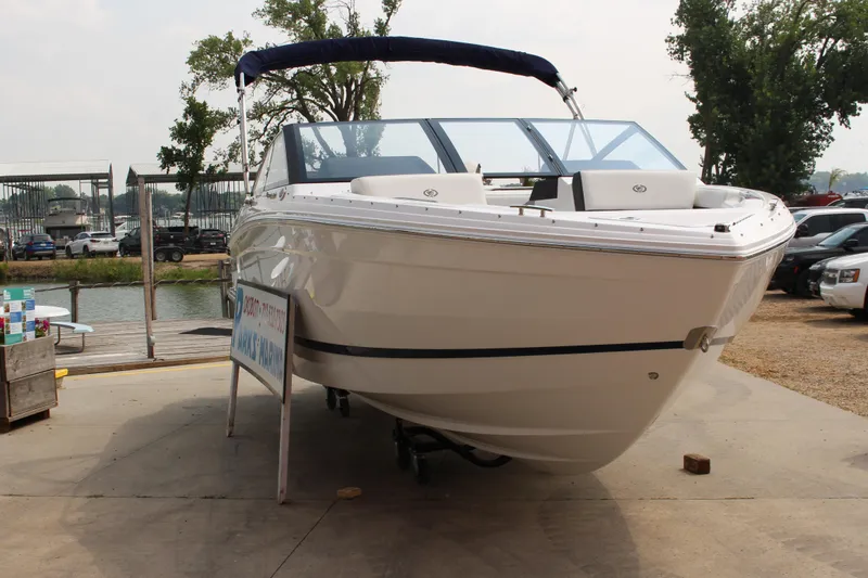 Slide: The Image of 2025 Cobalt R4 Surf boat displayed on a dock, ready for water adventures. - 34