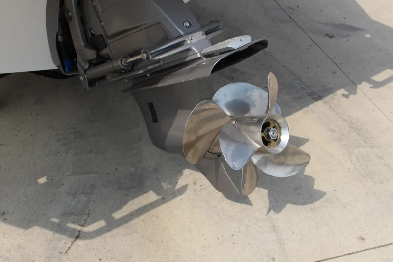 Slide: The Image of 2025 Cobalt R4 Surf boat propeller on concrete surface. - 5