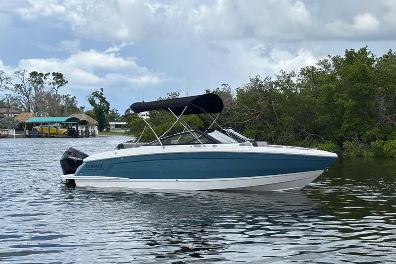 The Image of 2026 Cobalt R4 Outboard boat on calm water, featuring sleek design and modern features. - 1