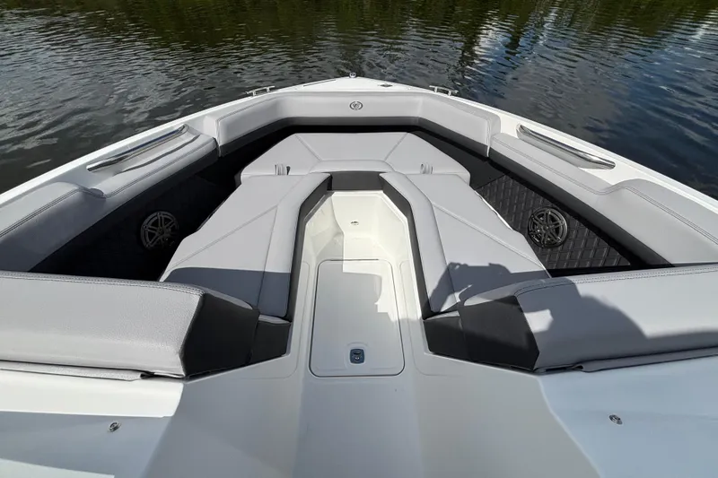 Slide: The Image of 2026 Cobalt R4 Outboard boat interior with sleek seating and modern design on calm water. - 14