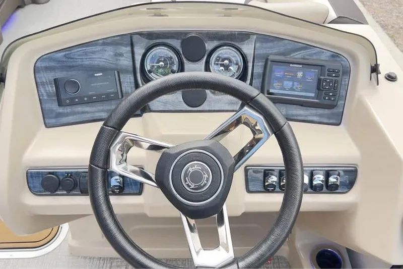 Slide: The Image of 2024 Avalon LSV 2585 dashboard with steering wheel, gauges, and navigation system. - 12