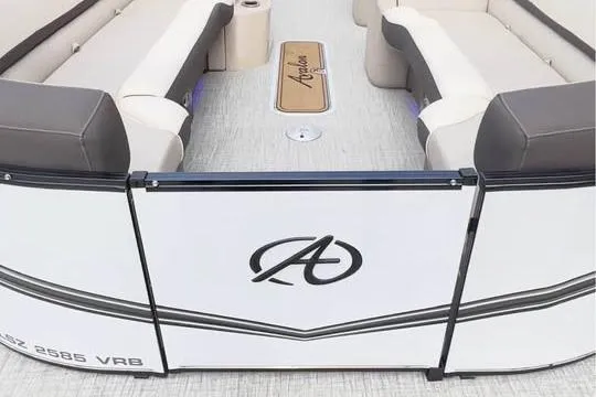 Slide: The Image of 2024 Avalon LSV 2585 boat interior with seating and logo detail. - 14