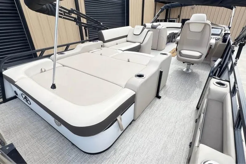 Slide: The Image of 2024 Avalon LSV 2585 pontoon boat interior with luxurious seating and modern design. - 3