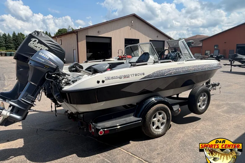 Slide: The Image of 2007 Ranger 1760 Angler boat with Yamaha motor on trailer, parked outdoors. - 2