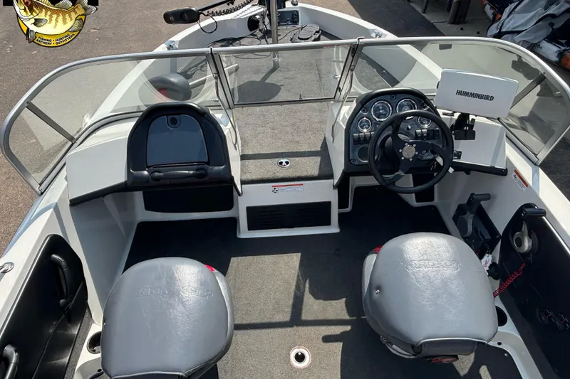 Slide: The Image of 2007 Ranger 1760 Angler boat interior with steering wheel, seats, and Humminbird fish finder. - 8