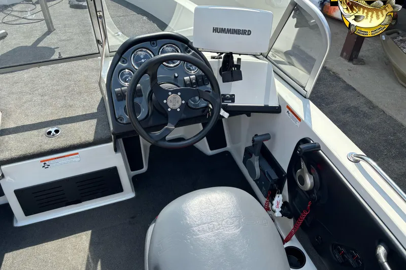 Slide: The Image of 2007 Ranger 1760 Angler boat cockpit with steering wheel and Humminbird fish finder. - 9