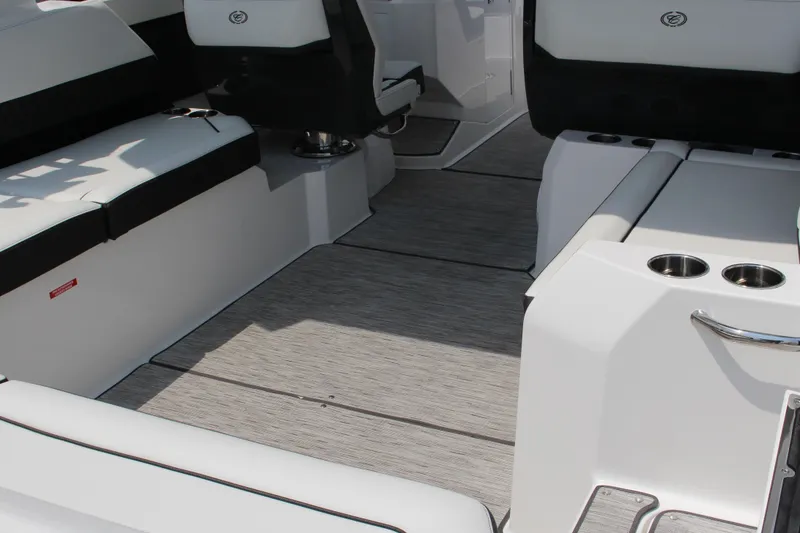 Slide: The Image of Interior of 2025 Cobalt R31 Surf boat with sleek seating and cup holders. - 10
