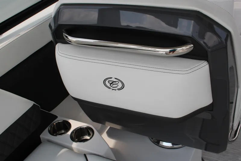 Slide: The Image of 2025 Cobalt R31 Surf boat interior with sleek white seating and cup holders. - 16