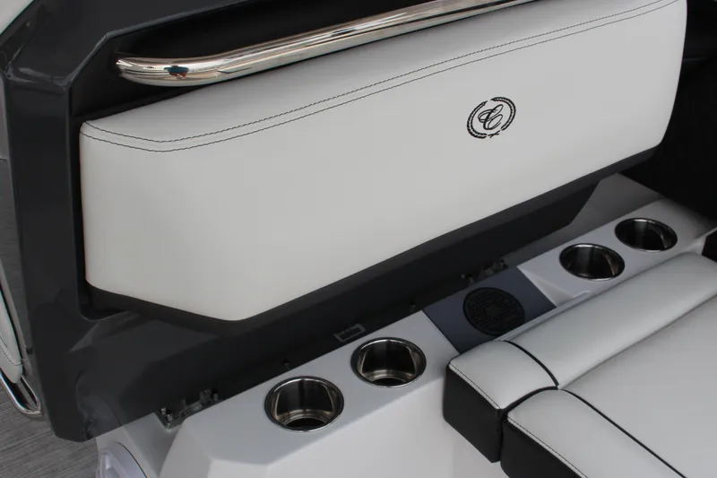 Slide: The Image of 2025 Cobalt R31 Surf boat interior with white seating and cup holders. - 17
