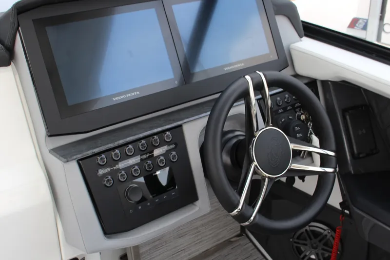 Slide: The Image of 2025 Cobalt R31 Surf boat dashboard with dual screens and modern steering wheel. - 18