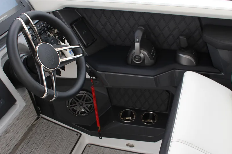 Slide: The Image of 2025 Cobalt R31 Surf boat cockpit with steering wheel and controls. - 20