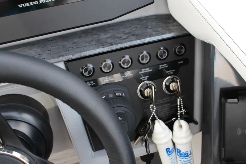Slide: The Image of Control panel of 2025 Cobalt R31 Surf boat with ignition keys and switches. - 22