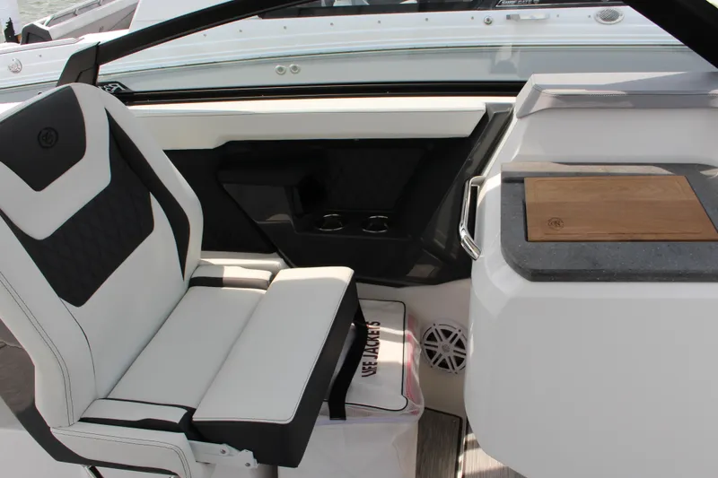 Slide: The Image of Interior of 2025 Cobalt R31 Surf boat with modern seating and storage. - 23