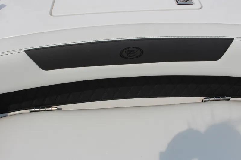 Slide: The Image of 2025 Cobalt R31 Surf boat interior detail with sleek black and white design. - 32